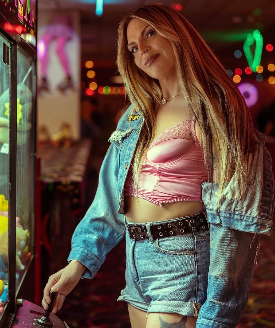 Playful pink satin and denim look with sun-kissed glam at the arcade